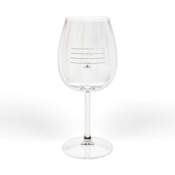 Clear glass wine glass with black measurement lines for 5 CL, 10 CL, 15 CL, and FIN DE STOCK text with a bee icon.